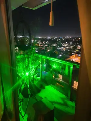 a room with a view of a city at night at Terra Zión in Cordoba