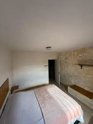 a bedroom with a large bed in a room at Depto Maipu in Cordoba