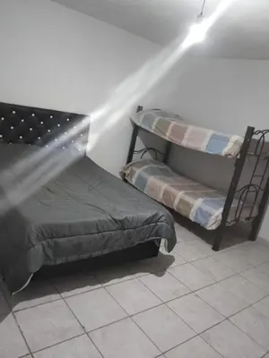 a room with two bunk beds and a light at El portal in Cordoba