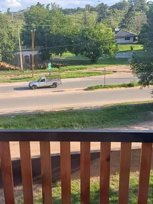 an old car driving down a street at Altos Aparts cabañas in Estancia Vieja