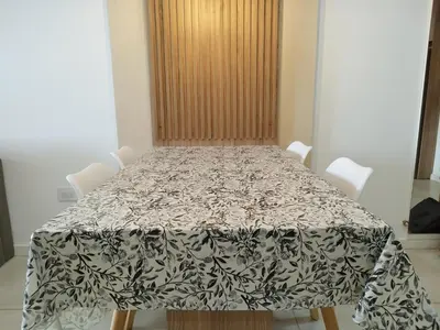a dining room table with a black and white table cloth at Departamento 1 dormitorio ubicado en zona estratégica de Nueva Córdoba in Cordoba
