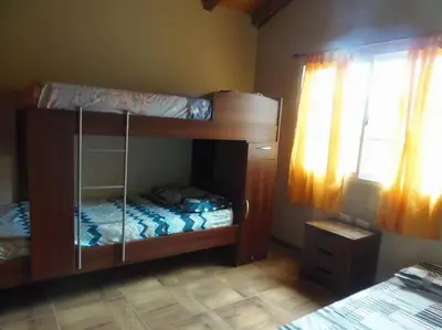 two bunk beds in a room with a window at Cabañas Chakra Raiz in Pantanillo
