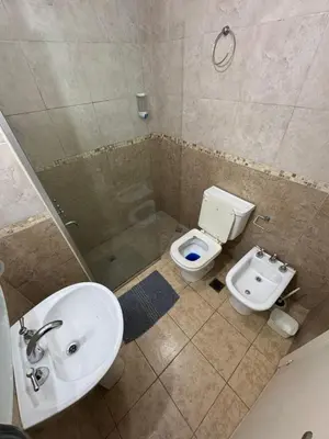 a bathroom with a sink and a toilet and a shower at Pringles - 1 dormitorio Bº General Paz in Cordoba