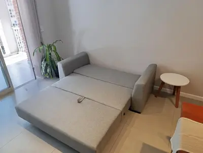 a living room with a couch and a table at Departamento moderno en Barrio General Paz in Cordoba