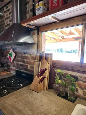a kitchen counter with a knife block on it at Descanso Serrano in Las Rabonas
