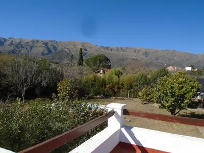 a view from the balcony of a house with mountains in the background at Hostería de los Césares in Merlo