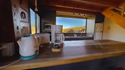 a kitchen with a counter with a blender on it at Cuesta de las Piedras in La Cumbrecita