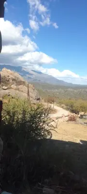 a person standing on a hill looking at a dirt road at Suite's on the rock's in Nono