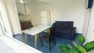 a small kitchen with a table and a chair at Complejo La Tere- depto 3 in Cordoba