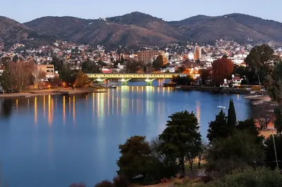 a view of a city with a bridge over a river at Departamento con hermosa vista en Carlos Paz in La Cuesta