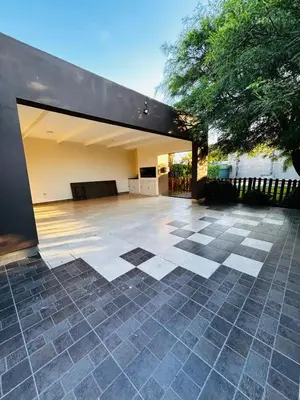an outdoor patio with a checkered tile floor at Confortable Casa en Pilar Rio II in Pilar