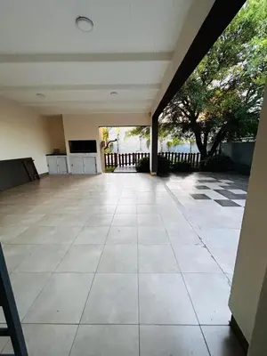 an empty room with a large tile floor at Confortable Casa en Pilar Rio II in Pilar