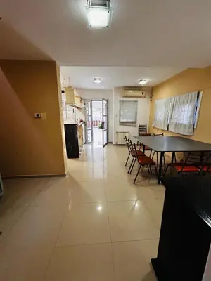 a kitchen and dining room with a table and chairs at Confortable Casa en Pilar Rio II in Pilar