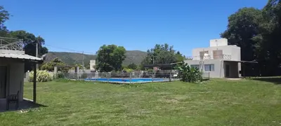 a house with a swimming pool in a yard at Cabañas Las Luceros in San Antonio de Arredondo