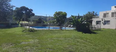 a yard with a swimming pool in a house at Cabañas Las Luceros in San Antonio de Arredondo