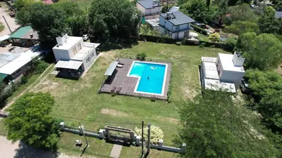 an aerial view of a yard with a swimming pool at Cabañas Las Luceros in San Antonio de Arredondo