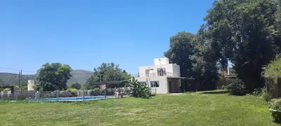 a house with a swimming pool in a yard at Cabañas Las Luceros in San Antonio de Arredondo