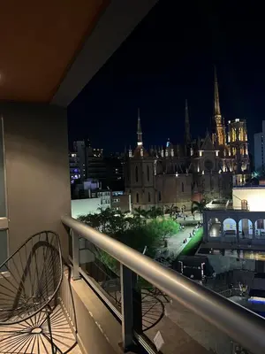 a balcony with a view of a city at night at Miradores del buen pastor - Nueva cordoba in Cordoba