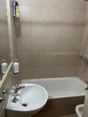 a bathroom with a sink and a bath tub with a sink at Miradores del buen pastor - Nueva cordoba in Cordoba