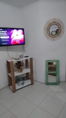 a living room with a tv on a wall at Departamento amplio, Zona Nueva Cba , A cien metros de la terminal Buss in Cordoba
