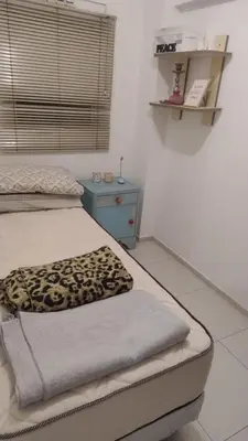 a bedroom with a bed with a leopard blanket on it at Departamento amplio, Zona Nueva Cba , A cien metros de la terminal Buss in Cordoba