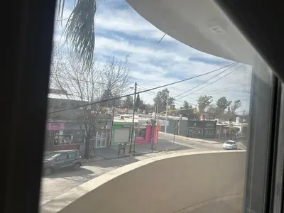 a view of a city street from a window at Departamento in Alta Gracia