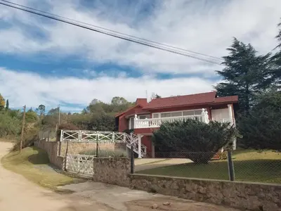 a house on the side of a road at La Casa del Lago in Villa Santa Cruz del Lago