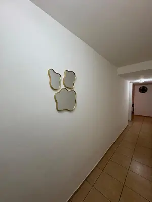 a wall with a logo on a white wall at Departamento Excelente Ubicación ! in Cordoba