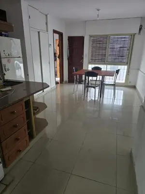 a kitchen and dining room with a table and chairs at Departamento - Cerro de las Rosas, Cordoba - 5 personas in Cordoba