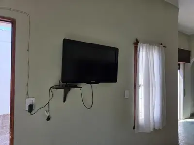 a flat screen tv hanging on a wall at RS Home in Río Cuarto