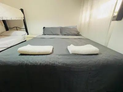 a bed with two white pillows on top of it at Apartment in Nueva Córdoba in Cordoba