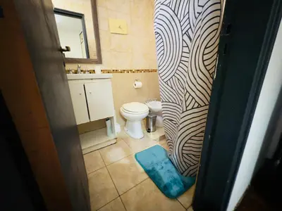 a bathroom with a toilet and a sink at Apartment in Nueva Córdoba in Cordoba