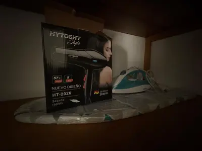 a box sitting on top of a bed at Apartment in Nueva Córdoba in Cordoba