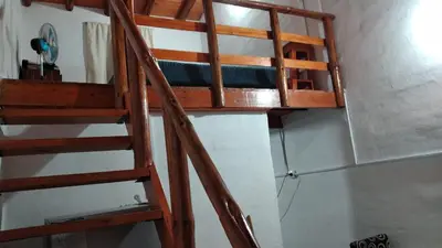 a ladder leading up to a bunk bed in a room at Alquiler villa dolores in San Javier