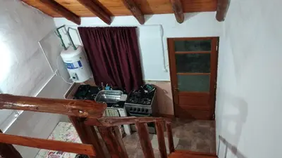 a kitchen with a stove and a sink in a room at Alquiler villa dolores in San Javier