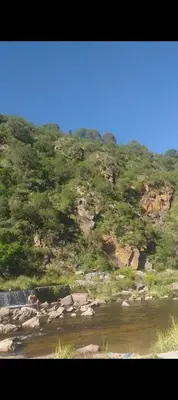 a view of a river and a hill with trees at Alquiler villa dolores in San Javier