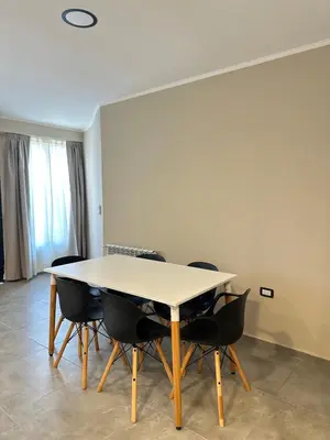 a meeting room with a table and chairs at Departamentos Sol y Lago in Villa Carlos Paz