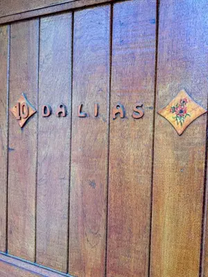 a wooden door with the word pandas written on it at Alta Montaña Hosteria&Apart in Los Hornillos