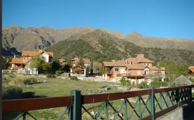 a group of houses with mountains in the background at Casa en las sierras de Merlo in Merlo