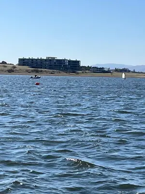 a large body of water with a building in the background at Puerto del Águila Departamento con vista al lago- The View Luxuary Aparts in Potrero de Garay