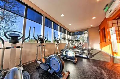 a gym with three exercise bikes in a room at Departamento Amoblado Premium en Opera Luxury in Cordoba