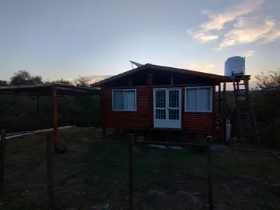 a small house in the middle of a yard at La casita de la montaña in El Parador