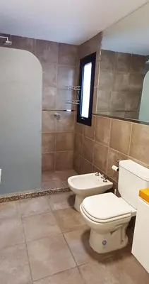 a bathroom with a toilet and a shower at Departamento alquiler temporal Barrio General Paz in Cordoba