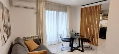 a living room with a couch and a table at Departamento alquiler temporal Barrio General Paz in Cordoba