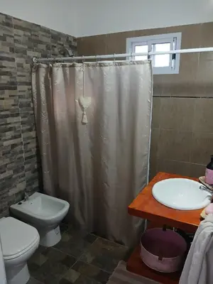 a bathroom with a toilet and a sink at Respira Alegría in Carpintería
