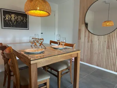 a dining room with a wooden table with wine glasses at A estrenar!! Nordic Chic in Cordoba