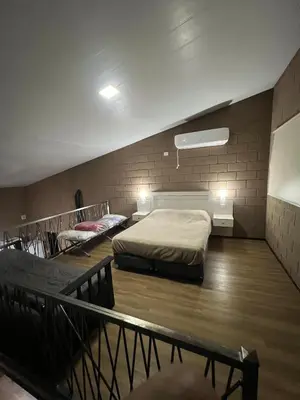 a bedroom with two beds in a room at Chalet en Potrero de Garay in La Estancia