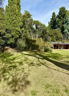 a large yard with a house and trees at Casita de campo La Añurita in San Javier