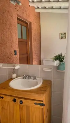 a bathroom with a sink and a mirror at Casita de campo La Añurita in San Javier