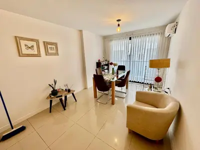 a living room with a table and a chair and a desk at Buena vista in Cordoba